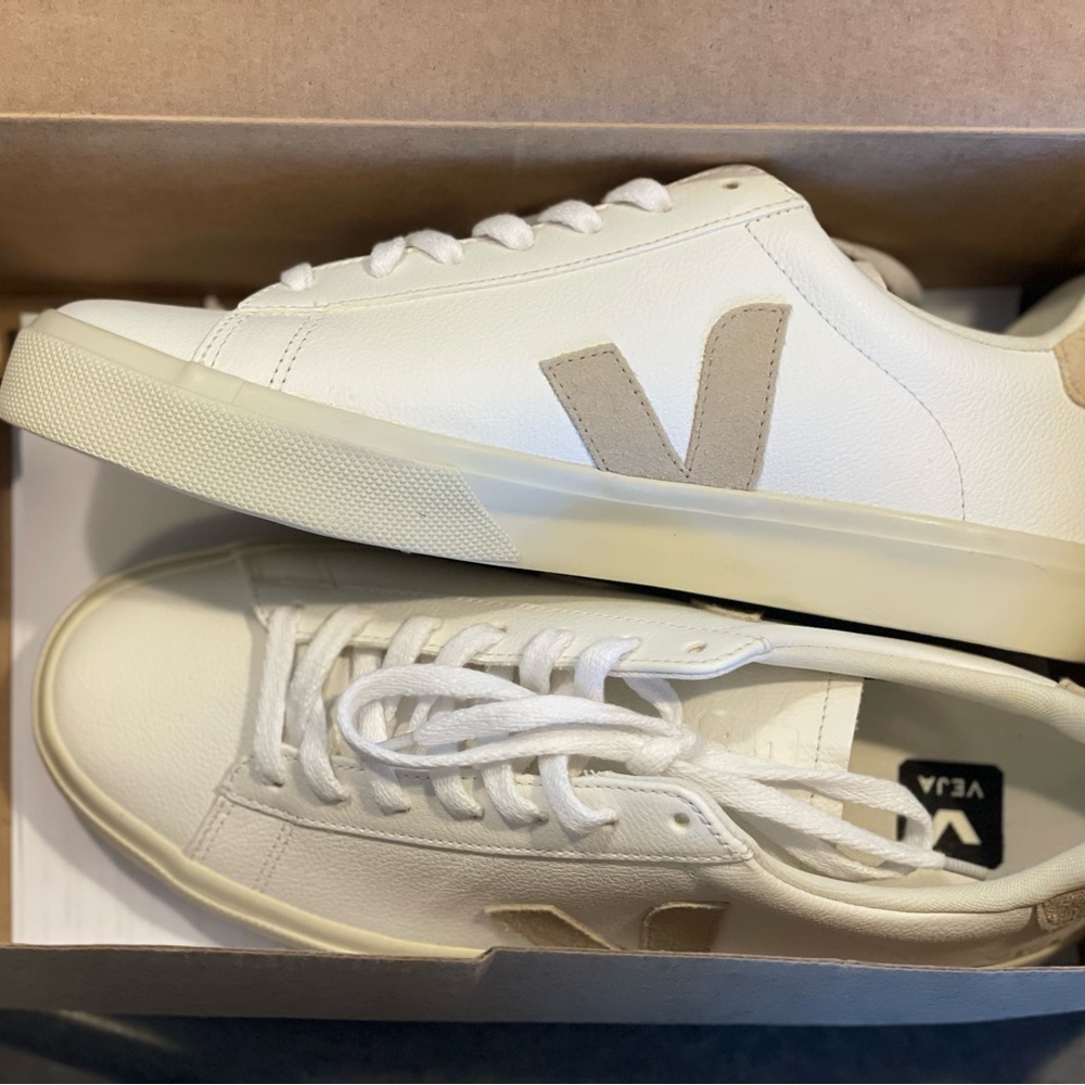 Size 9, fits more like 10, never worn Veja sneakers. White and tan.